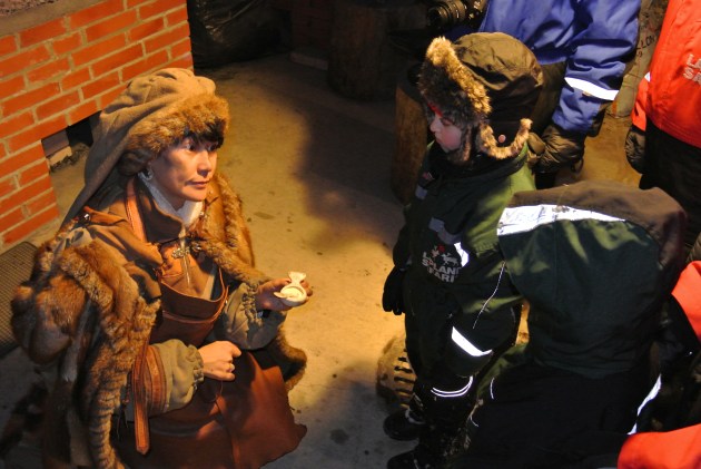 The Blacksmith Elf showing her Magic elf dust to the Children